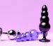 3D illustration, a collection of different types colorful  of sex toys, including dildo and   butt anal plugs on  pink background.